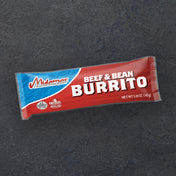 A package of midamar beef and bean burrito on a dark background.